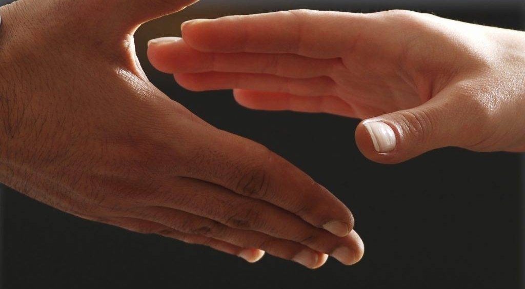 Hands coming together for adult autism support